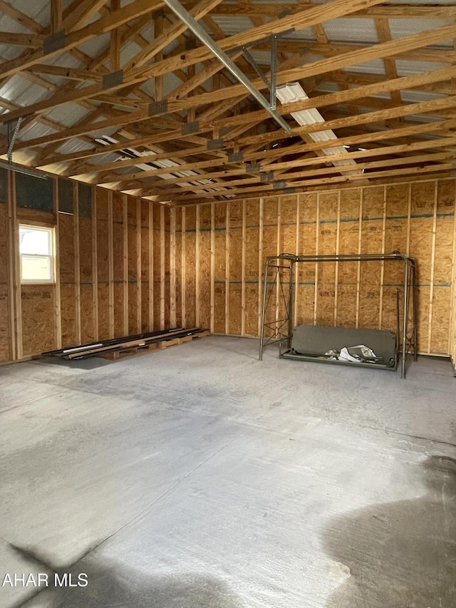 misc room with concrete flooring