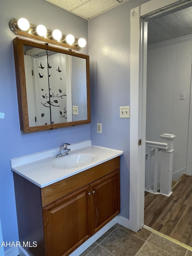 bathroom with vanity and wood-type flooring