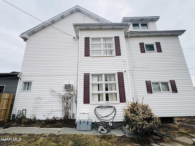 back of house featuring central AC unit