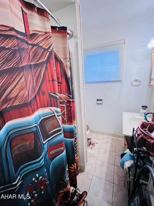 bathroom with vanity and tile patterned floors