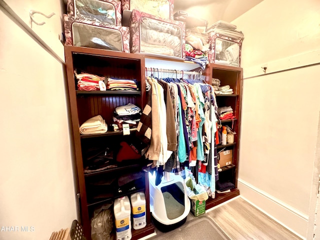 spacious closet featuring wood finished floors