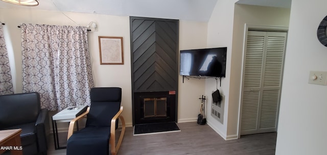 sitting room with wood-type flooring