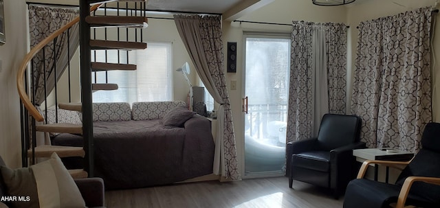 living area with light hardwood / wood-style flooring and a wealth of natural light