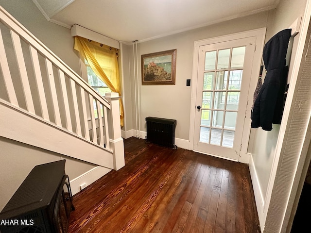 entryway featuring dark wood-type flooring and ornamental molding