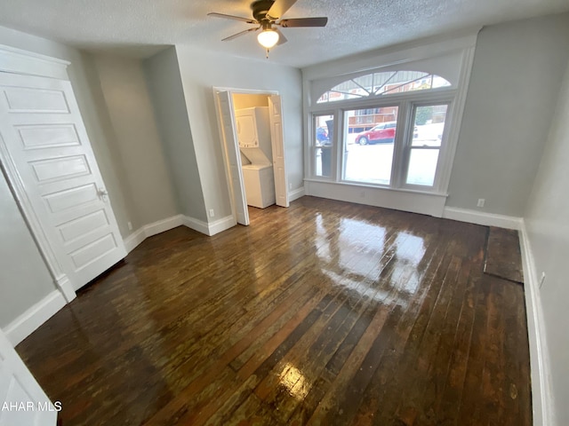 spare room with dark wood-type flooring, a ceiling fan, baseboards, and a textured ceiling