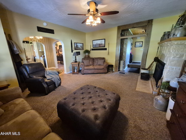 605 13th St, Duncansville, PA 16635 - carpeted living room featuring baseboards, arched walkways, a ceiling fan, and a fireplace