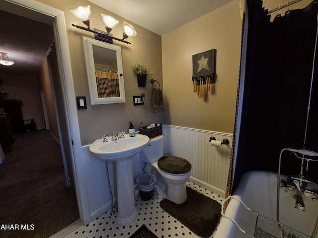 605 13th St, Duncansville, PA 16635 - bathroom featuring toilet and a wainscoted wall