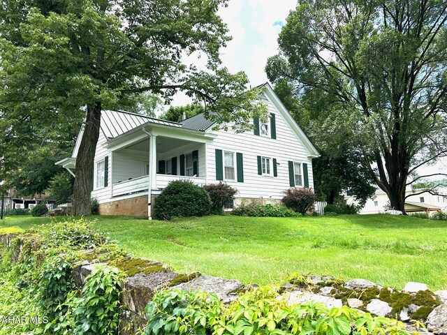 132 S Thomas St, Bedford, PA 15522 - view of home's exterior with a standing seam roof, a metal roof, and crawl space