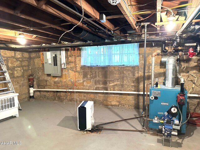 132 S Thomas St, Bedford, PA 15522 - unfinished basement featuring electric panel and a heating unit