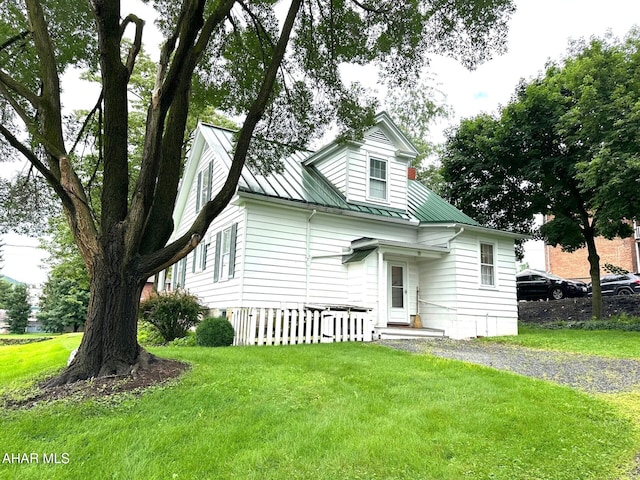 132 S Thomas St, Bedford, PA 15522 - view of front of house with a front lawn, a standing seam roof, and a metal roof