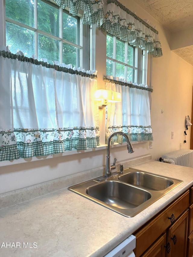 132 S Thomas St, Bedford, PA 15522 - kitchen featuring brown cabinets, light countertops, and a textured ceiling