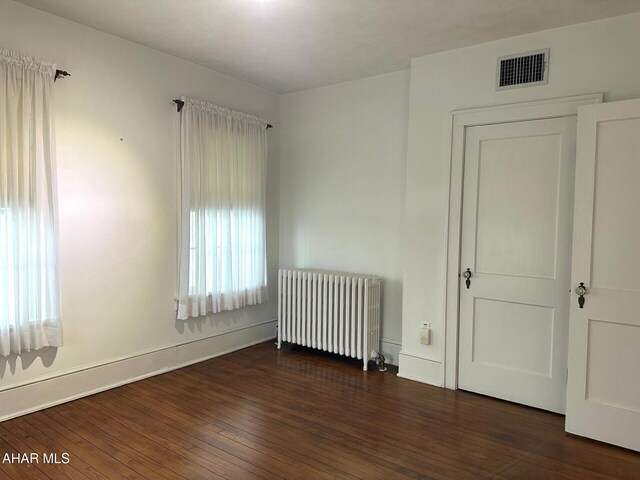 132 S Thomas St, Bedford, PA 15522 - unfurnished room with radiator and wood finished floors