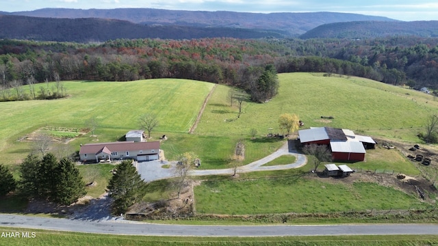 drone / aerial view with a mountain view and a rural view