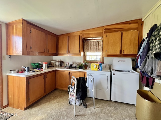 laundry room featuring cabinets and separate washer and dryer