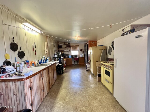 kitchen with sink and white appliances