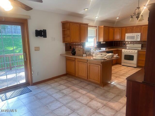 116 Estate Dr, Duncansville, PA 16635 - kitchen featuring white appliances, a peninsula, decorative backsplash, and ceiling fan