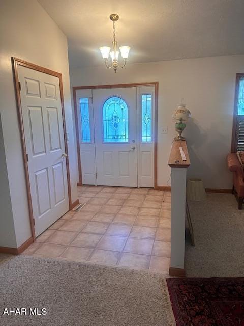 116 Estate Dr, Duncansville, PA 16635 - foyer featuring a chandelier and light colored carpet