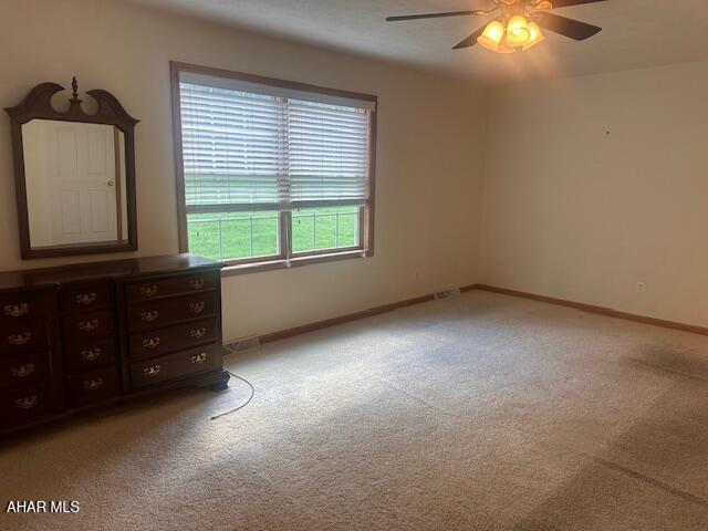 116 Estate Dr, Duncansville, PA 16635 - unfurnished bedroom featuring light colored carpet and a ceiling fan