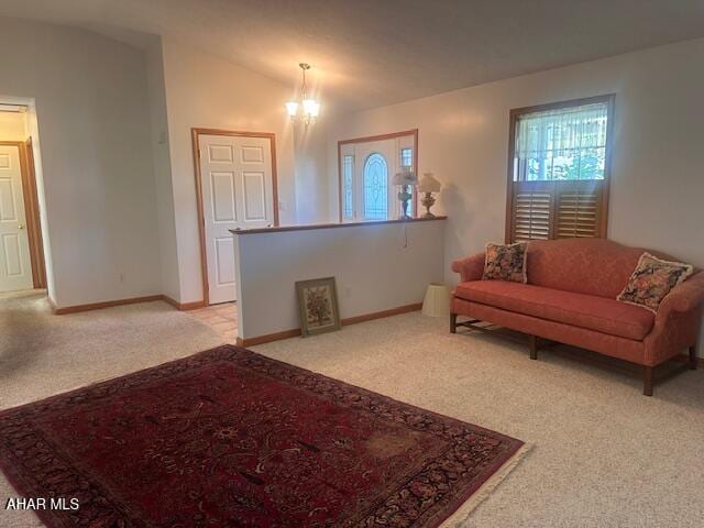 116 Estate Dr, Duncansville, PA 16635 - living area with light colored carpet, a chandelier, and lofted ceiling