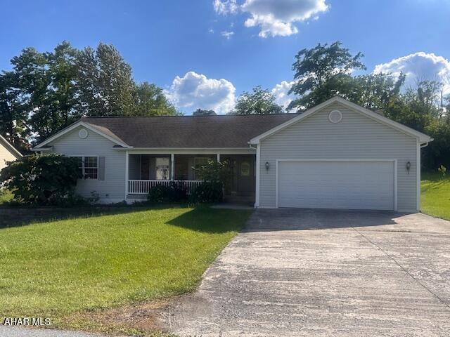 116 Estate Dr, Duncansville, PA 16635 - ranch-style house with a porch, driveway, a front lawn, and a garage