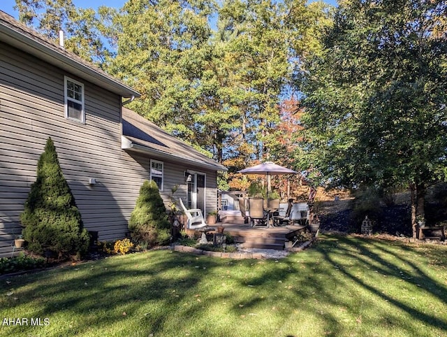 view of yard with a wooden deck