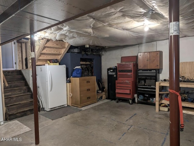 basement with white refrigerator