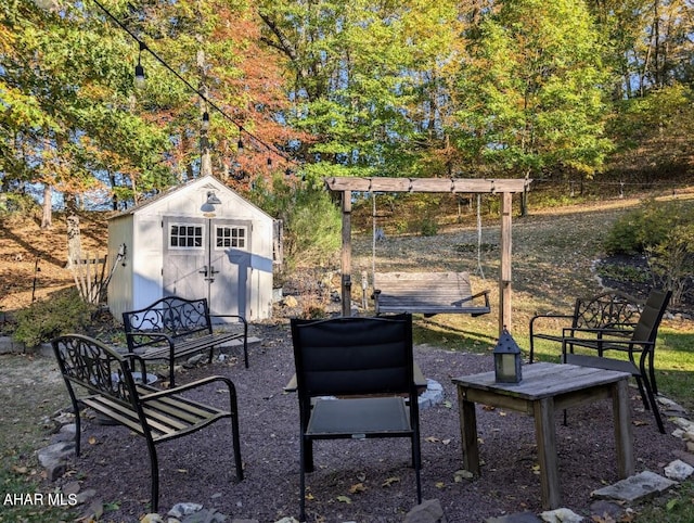 view of patio / terrace featuring a storage unit