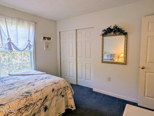 carpeted bedroom with a closet