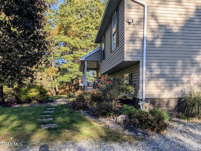 view of home's exterior featuring a yard