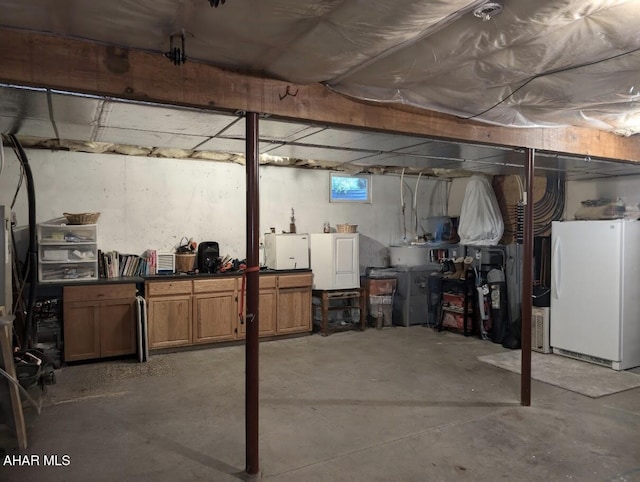 basement with white fridge