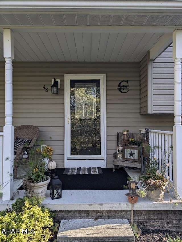 property entrance featuring covered porch