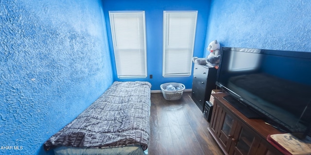 bedroom featuring dark wood-type flooring