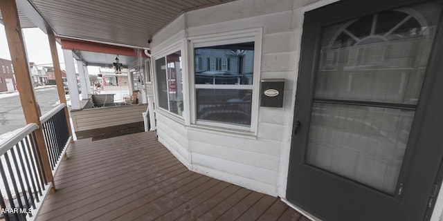 wooden terrace with a porch