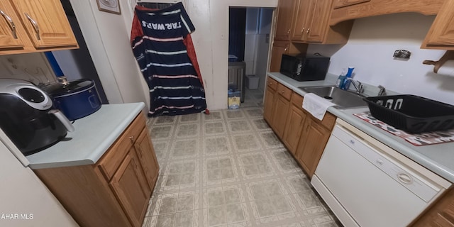 kitchen with sink and white dishwasher