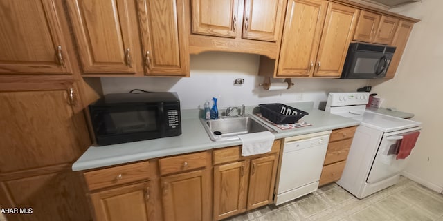 kitchen with range with electric stovetop, sink, white dishwasher, and washer / dryer