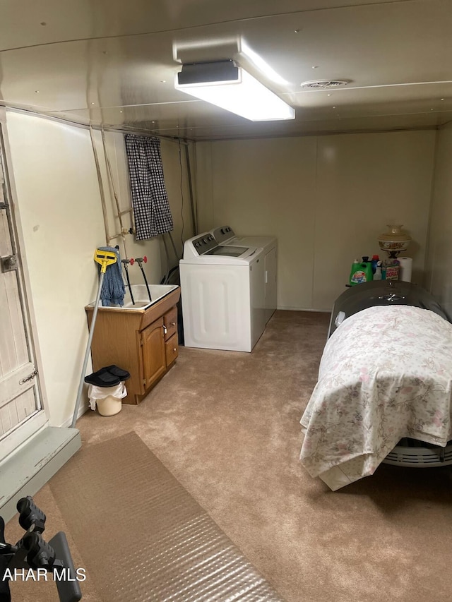 interior space with light carpet and washing machine and clothes dryer