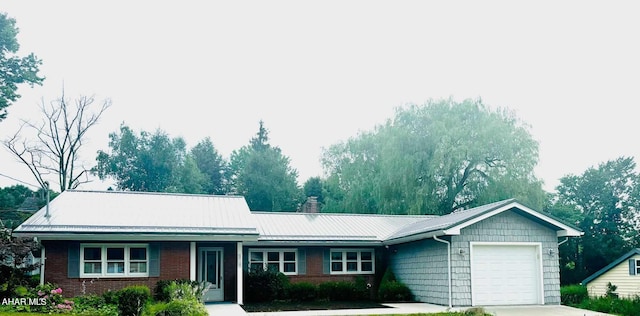 ranch-style home featuring a garage