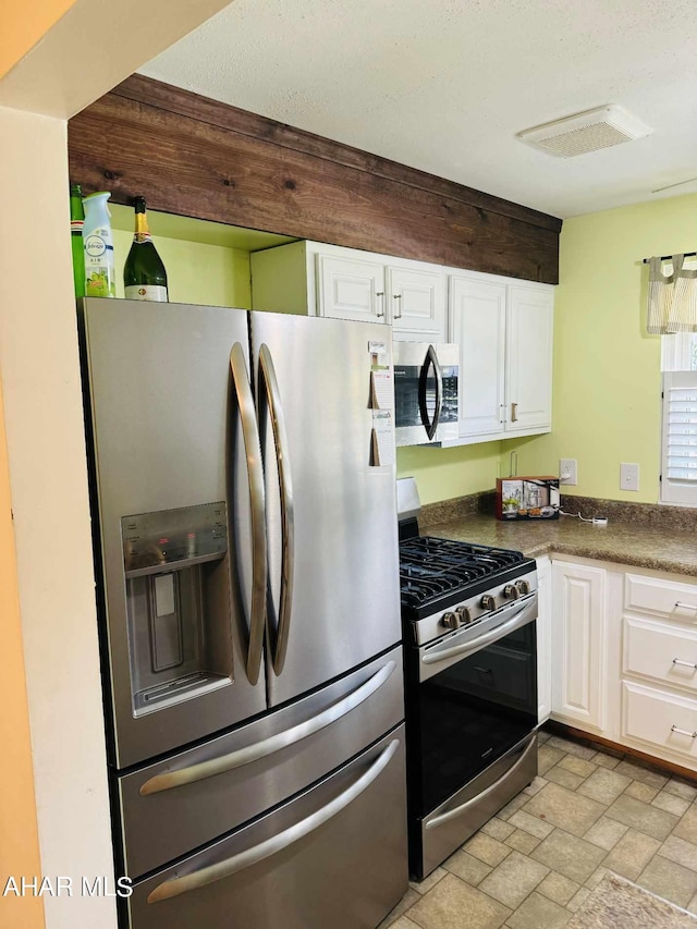 kitchen with white cabinets and stainless steel appliances