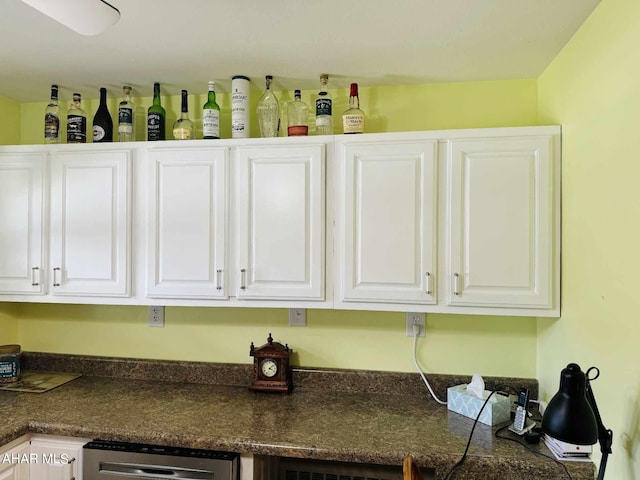 interior space featuring dishwasher and bar