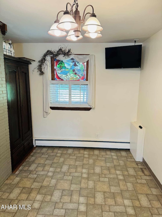 unfurnished dining area featuring a notable chandelier and a baseboard heating unit