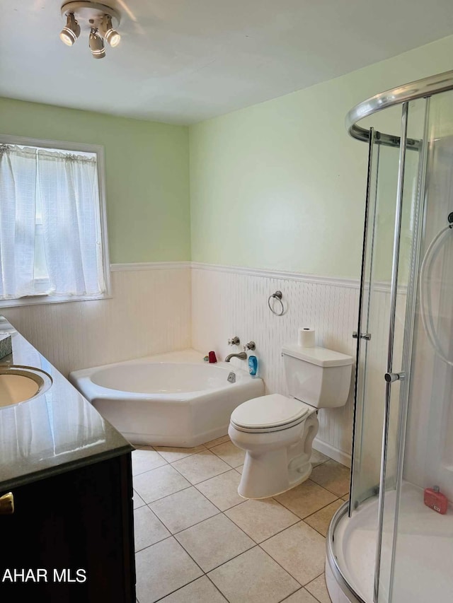 full bathroom with tile patterned floors, plus walk in shower, vanity, and toilet