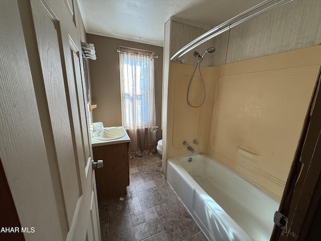 full bathroom with tub / shower combination, toilet, vanity, and crown molding