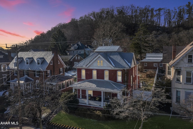 view of back house at dusk