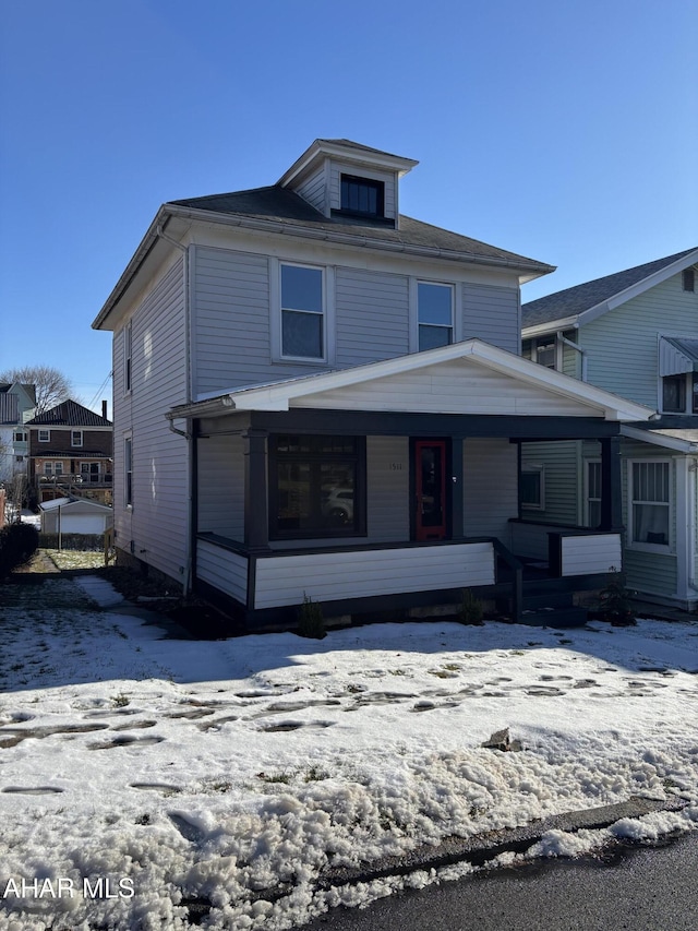 view of property featuring a porch