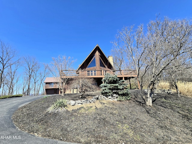 116 Scenic Knoll Dr, Hollidaysburg, PA 16648 - view of front of property featuring a wooden deck, aphalt driveway, and a chimney