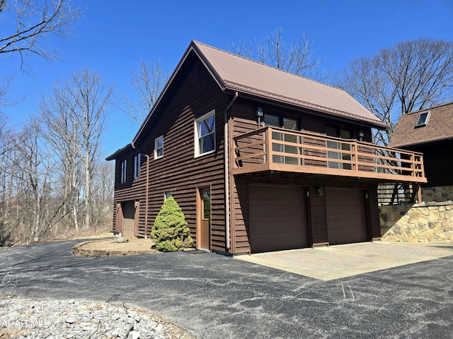116 Scenic Knoll Dr, Hollidaysburg, PA 16648 - rustic home featuring metal roof, driveway, a garage, and a balcony