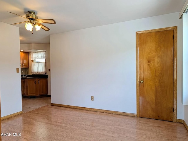 interior space featuring ceiling fan and light wood-type flooring