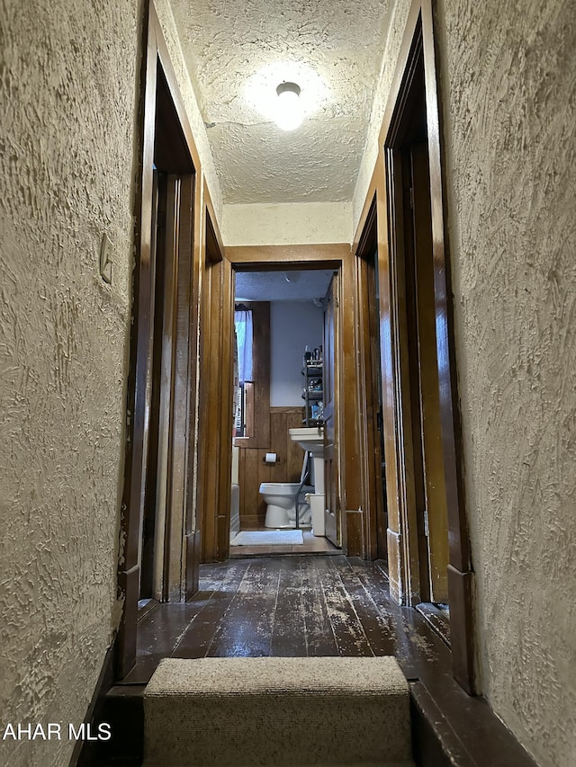 3785 Brumbaugh Rd, New Enterprise, PA 16664 - corridor featuring a textured wall and a wainscoted wall