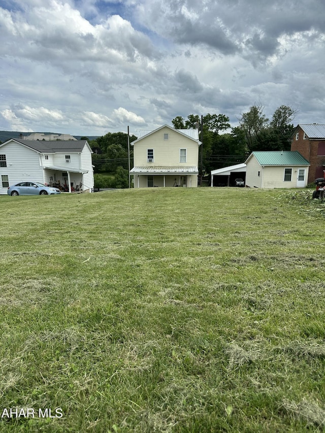 3785 Brumbaugh Rd, New Enterprise, PA 16664 - view of grassy yard with a carport