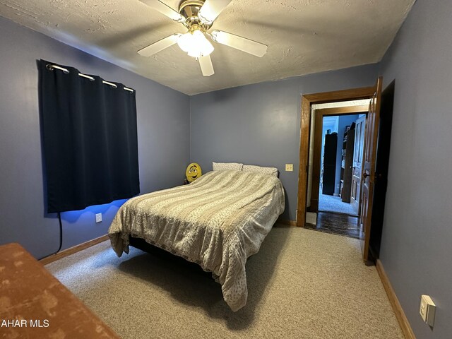 3785 Brumbaugh Rd, New Enterprise, PA 16664 - carpeted bedroom featuring ceiling fan and a textured ceiling